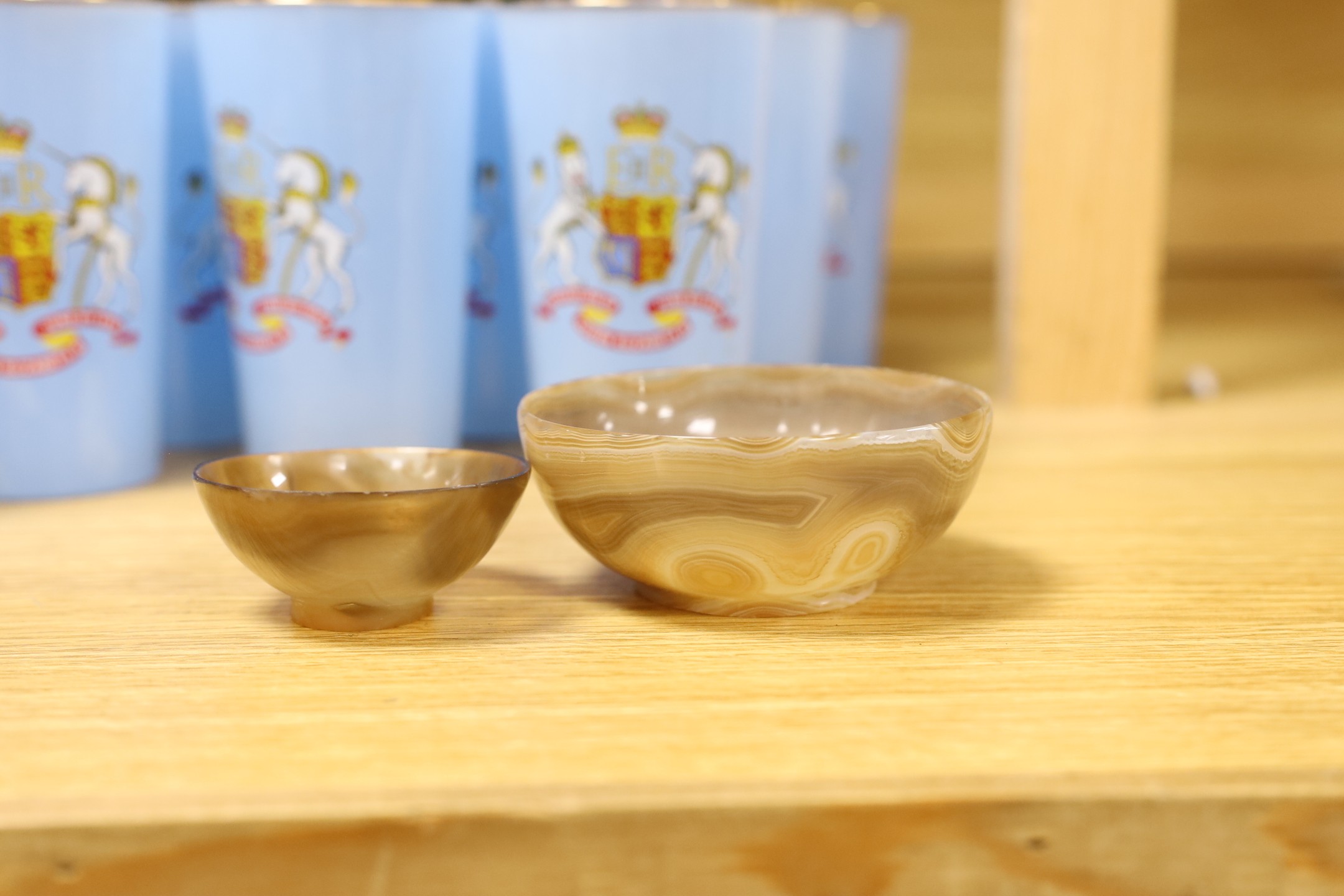 An assortment of twenty-four Coronation glasses in celebration of Queen Elizabeth II, together with other glassware and items to include a Baccarat model of a bird